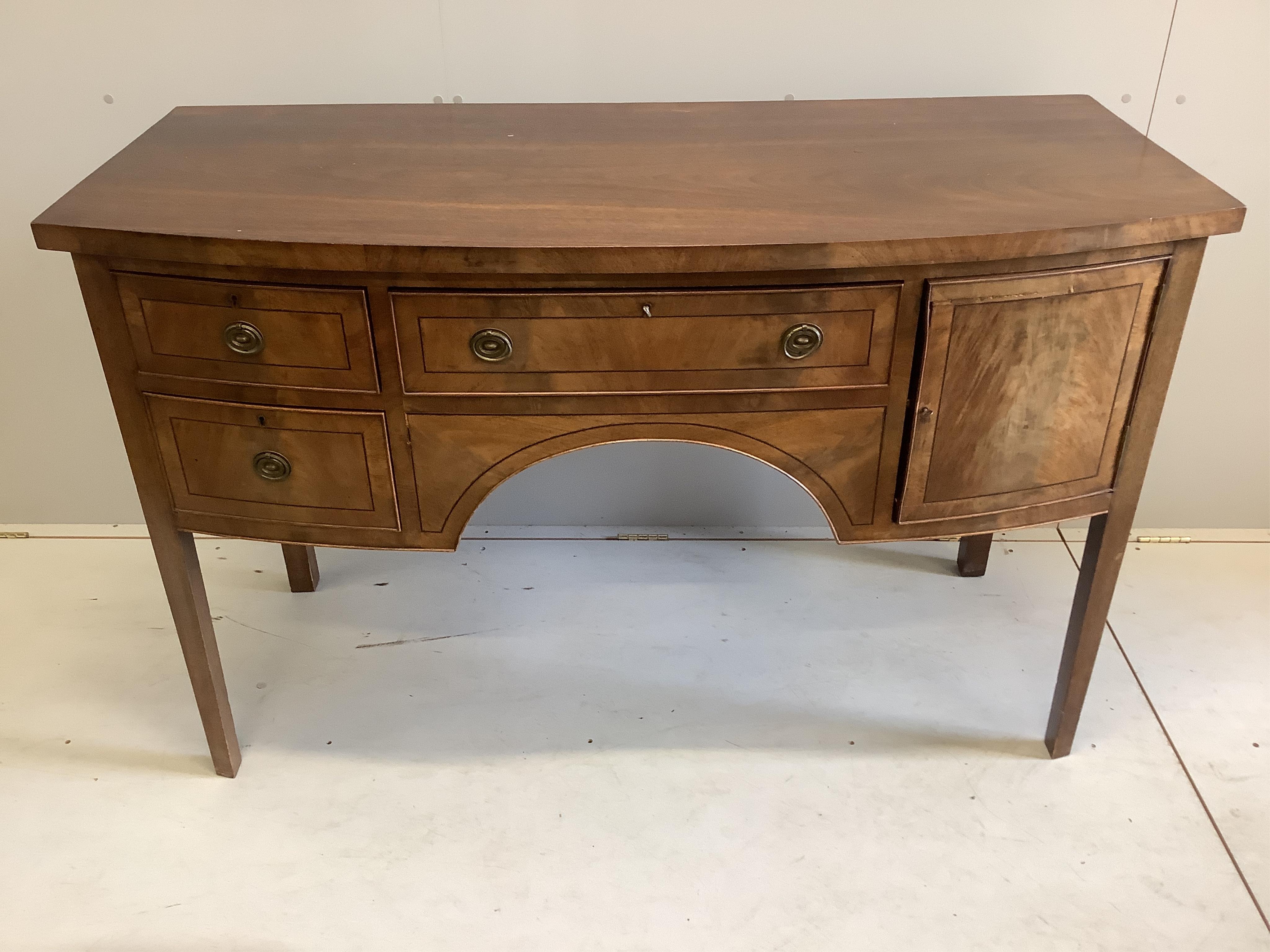 A George III style oval mahogany drop leaf dining table, 155cm extended, depth 106cm, height 74cm, together with a Regency style mahogany bowfront sideboard and six Hepplewhite style mahogany dining chairs. Condition - f